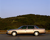 AUT 25 RK0707 02
1998 Cadillac De Ville Champagne Profile On Pavement Hills Blue Sky