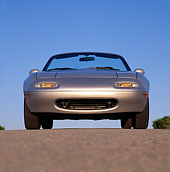 AUT 25 RK0769 05
1990 Mazda Miata Convertible Silver Low Head On Shot On Pavement Blue Sky