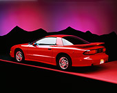 AUT 25 RK0840 04
1993 Pontiac Trans Am Red  Rear 3/4 On Red Floor Purple Mountains Background