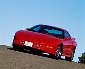 AUT 25 RK0852 12
1993 Pontiac Firebird Trans Am Red Slanted 3/4 Front View On Pavement Hill Blue Sky