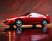 AUT 25 RK0854 03
1993 Toyota Supra Red 3/4 Side View On Mylar Floor Red Clouds Studio