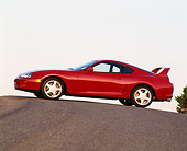 AUT 25 RK0863 01
1993 Toyota Supra Red 3/4 Front View On Pavement Hill Blue Sky