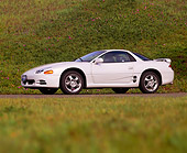 AUT 25 RK0871 16
1994 Mitsubishi 3000 V4 White Low 3/4 Side View Grass Hill