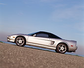 AUT 25 RK0920 05
1993 Acura NSX Silver Slanted Profile View On Pavement Hill Blue Sky