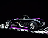 AUT 25 RK1051 07
1999 Moal Special Roadster Black 3/4 Rear View On Checkerboard Purple Lighting Studio