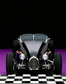 AUT 25 RK1052 02
1999 Moal Special Roadster Black Head On View On Checkerboard And Purple Floor Studio