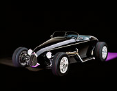 AUT 25 RK1056 05
1999 Moal Special Roadster Black 3/4 Front View On Purple Floor White Lighting Studio