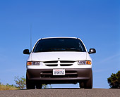AUT 25 RK1058 04
1996 Dodge Caravan White Low Head On Shot On Pavement Blue Sky