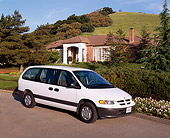 AUT 25 RK1060 01
1996 Dodge Caravan White Front 3/4 View On Pavement By Trees And Bushes