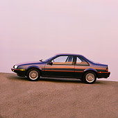 AUT 25 RK1066 03
1990 Chevrolet Beretta Blue Profile View On Pavement Hill Filtered