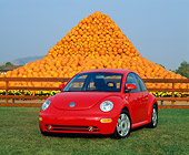 AUT 25 RK1093 06
1999 Volkswagen Beetle Turbo Red 3/4 Front View On Grass Pumpkins Background
