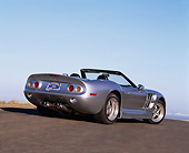 AUT 25 RK1108 01
1999 Shelby Series 1 Convertible Silver 3/4 Rear View On Pavement Blue Sky