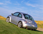 AUT 25 RK1134 03
1998 VW New Beetle Turbo Silver Slanted Low 3/4 Rear View On Grass Blue Sky