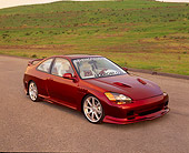 AUT 25 RK1183 02
1994 Honda Civic Ex Coupe Chameleon Paint 3/4 Front View On Pavement By Grass Hill