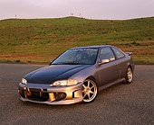 AUT 25 RK1189 02
1995 Honda Civic EX Coupe Silver Black Hood 3/4 Front View On Pavement Grass Hills