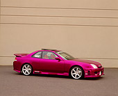AUT 25 RK1205 02
1997 Honda Prelude SH Candy Violet 3/4 Side View On Pavement By Wall