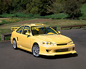 AUT 25 RK1228 02
1998 Honda Civic Custom Yellow 3/4 Front View On Pavement By Grass And Trees