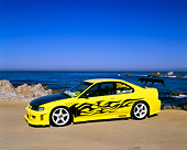 AUT 25 RK1239 01
1994 Honda Accord LX Yellow Black Flames 3/4 Side View On Sand By Ocean