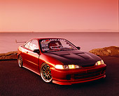AUT 25 RK1297 01
1997 Acura Integra Red 3/4 Front View On Pavement By Water Filtered