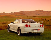 AUT 25 RK1370 03
1999 Nissan Skyline GTR R34 White 3/4 Rear View On Grass Hills Filtered