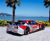 AUT 25 RK1378 03
1999 Nissan Skyline Nismo Race Car Red 3/4 Rear View By Water And Palm Trees