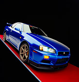AUT 25 RK1391 06
1999 Nissan Skyline GTR Blue Slanted 3/4 Front View On Red Floor Gray Line Studio