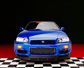 AUT 25 RK1395 01
1999 Nissan Skyline GTR Blue Head On Shot On Checkered And Red Floor Studio