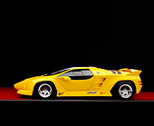 AUT 25 RK1401 07
1992 Vector W8 Yellow Profile View On Red Floor Gray Line Studio