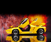 AUT 25 RK1404 06
1992 Vector W8 Yellow Profile View Door And Trunk Open On Mylar Floor Sunburst Background