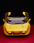 AUT 25 RK1406 28
1992 Vector W8 Yellow Head On View Doors Open On Red Floor Studio