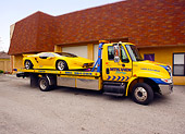 AUT 25 RK1407 01
1992 Vector W-8 Twin Turbo Yellow On Tow Truck By Building