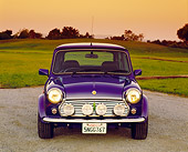 AUT 25 RK1421 04
1998 Rover, Mini, Blue Head On Shot On Pavement By Grass And Trees