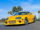 AUT 25 RK1435 01
1998 Toyota Supra Custom Yellow 3/4 Front View On Pavement Blue Sky