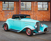 AUT 26 BK0012 01
1932 Ford Hot Rod Blue 3/4 Front View On Pavement By Brick Building
