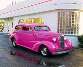 AUT 26 RK0240 02
1937 Chevy 350/350 Nova Panther Pink 3/4 Front View On Pavement By Diner