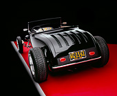 AUT 26 RK0541 09
1929 Ford Track Nose Roadster Black And Cream Rear 3/4 View On Red Floor Studio