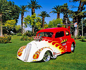 AUT 26 RK0580 02
1948 Anglia Coupe Red With Flames 3/4 Front View On Grass By Trees