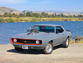 AUT 26 RK2784 01
1969 Chevrolet Camaro Gray 3/4 Front View On Gravel By Lake And Hills