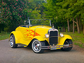 AUT 26 RK2794 01
1931 Ford Roadster Hot Rod Yellow With Flames 3/4 Front View On Pavement By Trees