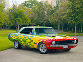AUT 26 RK2803 01
1970 Dodge Dart Swinger Hot Rod Red, Yellow, Green 3/4 Front View On Pavement By Trees
