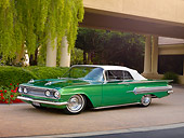 AUT 26 RK2817 01
1960 Chevrolet Impala Convertible Hot Rod Green 3/4 Front View On Pavement By Trees And Building