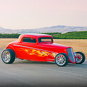 AUT 26 RK2850 01
1933 Ford Hi-Boy Coupe Hot Rod Red 3/4 Front View On Pavement By Dry Grass