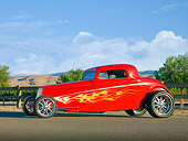 AUT 26 RK2852 01
1933 Ford Hi-Boy Coupe Hot Rod Red 3/4 Front View On Pavement