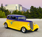 AUT 26 RK2894 01
1933 Ford Vicky Hot Rod Yellow And Purple 3/4 Front View On Pavement