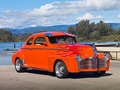 AUT 26 RK2898 01
1941 Pontiac Special Coupe Hot Rod Orange With Flames 3/4 Front View On Pavement By Lake