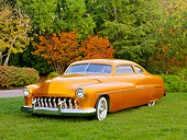 AUT 26 RK2901 01
1951 Mercury Coupe Hot Rod Gold 3/4 Front View On Grass By Trees