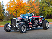 AUT 26 RK2923 01
1932 Ford Roadster Hot Rod Black With Decals 3/4 Front View On Pavement By Trees