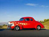 AUT 26 RK2932 01
1940 Ford Deluxe Coupe Hot Rod Red With Flames 3/4 Front View On Pavement