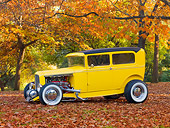 AUT 26 RK2937 01
1931 Ford Sedan Hot Rod Yellow 3/4 Front View On Fallen Leaves By Trees