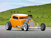 AUT 26 RK2979 01
1934 Chevrolet Coupe Hot Rod Orange 3/4 Front View On Pavement By Grassy Hill